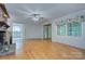 Spacious living room featuring hardwood floors and a sliding door to the outside at 2235 Ramblewood Ln, Charlotte, NC 28210