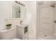 Bright bathroom features a white vanity, updated fixtures, and a walk-in shower at 235 River Loop Rd, Belmont, NC 28012