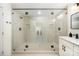 Modern bathroom with a large glass walk-in shower, black hardware, and tiled walls at 235 River Loop Rd, Belmont, NC 28012