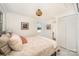 Cozy bedroom with a comfortable bed, artwork, and a closet with folding doors at 235 River Loop Rd, Belmont, NC 28012