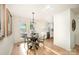 Bright dining area with hardwood floors and views of the patio and lake at 235 River Loop Rd, Belmont, NC 28012