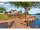 Waterfront property with private dock access, leading to serene lake views at 235 River Loop Rd, Belmont, NC 28012