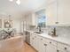 Bright kitchen with white cabinets, stainless steel appliances, quartz countertops, and decorative backsplash at 235 River Loop Rd, Belmont, NC 28012