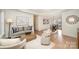 Bright living room featuring hardwood floors, neutral decor, and ample natural light at 235 River Loop Rd, Belmont, NC 28012