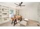 Bright office with built-in shelving, a ceiling fan, and a wooden desk with trestle legs at 235 River Loop Rd, Belmont, NC 28012