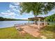 Outdoor living at its finest with a pergola overlooking the tranquil lake waters at 235 River Loop Rd, Belmont, NC 28012