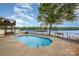 Sparkling pool offers a refreshing retreat with lake views and a spacious concrete patio at 235 River Loop Rd, Belmont, NC 28012