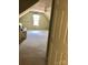 Spacious attic featuring a ceiling fan and natural light at 248 Aylesbury Ln, Indian Trail, NC 28079