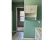 Bathroom featuring vanity, cabinet, and view into adjacent room with window at 248 Aylesbury Ln, Indian Trail, NC 28079