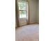 Bedroom featuring carpeted floors and a window with natural light at 248 Aylesbury Ln, Indian Trail, NC 28079