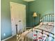 Cozy bedroom featuring a metal bed frame and ample natural light at 248 Aylesbury Ln, Indian Trail, NC 28079