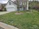 Charming two-story home featuring a well-maintained lawn and a mix of brick and siding exterior at 248 Aylesbury Ln, Indian Trail, NC 28079