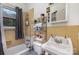 Small bathroom with shower-tub and white sink at 2622 Hemphill St, Charlotte, NC 28208