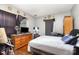 Bedroom featuring a dresser, window and gray walls at 2622 Hemphill St, Charlotte, NC 28208