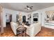 Inviting living room features hardwood floors, sofas, and a decorative shelving unit at 2622 Hemphill St, Charlotte, NC 28208