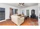 Bright living room showcasing hardwood floors, comfortable seating, and natural light at 2622 Hemphill St, Charlotte, NC 28208