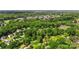 Wide shot of lush green trees and houses in a neighborhood setting at 301 Deer Creek Dr, Matthews, NC 28105