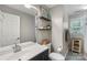 Bathroom with single vanity, toilet, and stylish decor at 301 Deer Creek Dr, Matthews, NC 28105