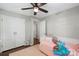 Bedroom with bed, ceiling fan, closet, natural light, and carpet at 301 Deer Creek Dr, Matthews, NC 28105