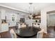 Open floor plan combining the dining and kitchen areas for seamless entertaining and living at 301 Deer Creek Dr, Matthews, NC 28105