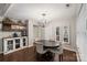 Comfortable dining room featuring a round table, decorative mirrors, and a charming coffee bar at 301 Deer Creek Dr, Matthews, NC 28105