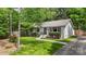 Beautiful landscaped home with a well-manicured lawn and a paved walkway at 301 Deer Creek Dr, Matthews, NC 28105