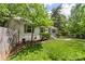 Charming home with lush green lawn and a border of landscaping at 301 Deer Creek Dr, Matthews, NC 28105