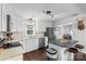 Well-lit kitchen equipped with an island, stainless steel appliances, and sleek white cabinetry at 301 Deer Creek Dr, Matthews, NC 28105