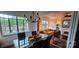Bright dining room featuring large windows, hardwood floors, and elegant chandelier lighting at 301 W 10Th W St, Charlotte, NC 28202