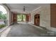 Covered entrance area features detailed masonry and manicured lawns at 301 W 10Th W St, Charlotte, NC 28202