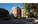 Classic brick apartment building with mature trees and inviting entrance at 301 W 10Th W St, Charlotte, NC 28202