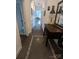 Inviting hallway with decorative flooring, leading to living areas, accented by a wooden table and wall decor at 301 W 10Th W St, Charlotte, NC 28202