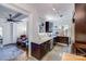 A modern kitchen features stainless steel appliances, granite counters, and dark cabinets at 301 W 10Th W St, Charlotte, NC 28202