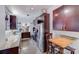 A modern kitchen features stainless steel appliances, granite counters, and dark cabinets at 301 W 10Th W St, Charlotte, NC 28202