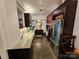 Modern kitchen with granite countertops, stainless steel appliances and lots of dark wood cabinetry. For sale by Canopy MLS 2025 at 301 W 10Th W St, Charlotte, NC 28202