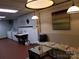 Laundry room with updated machines and comfortable seating area at 301 W 10Th W St, Charlotte, NC 28202