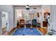 Cozy living room featuring classic furniture, a large window, and access to the kitchen, creating a comfortable space at 301 W 10Th W St, Charlotte, NC 28202