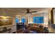 Cozy living room adjacent to the dining room with hardwood floors, fireplace, and natural lighting at 301 W 10Th W St, Charlotte, NC 28202