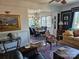 Bright and airy living room seamlessly connected to the dining area, perfect for entertaining. For sale by Canopy MLS 2025 at 301 W 10Th W St, Charlotte, NC 28202