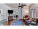Stylish living room with hardwood floors, a large rug, comfortable seating, and an open view into the next room at 301 W 10Th W St, Charlotte, NC 28202