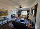 Inviting living room featuring hardwood floors, classic architecture, and abundant natural light. For sale by Canopy MLS 2025 at 301 W 10Th W St, Charlotte, NC 28202