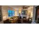 Comfortable living room with large window, ceiling fan, decorative fireplace, and plush seating at 301 W 10Th W St, Charlotte, NC 28202