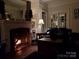 Cozy living room featuring a fireplace and a relaxing atmosphere. For sale by Canopy MLS 2025 at 301 W 10Th W St, Charlotte, NC 28202