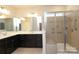 Modern bathroom featuring a double vanity, framed mirrors, and a glass-enclosed tiled shower at 309 Kentmere Ln, Clover, SC 29710