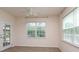 Bright bedroom with large windows, neutral walls, ceiling fan and wood-look flooring at 309 Kentmere Ln, Clover, SC 29710