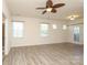 Bedroom with neutral walls, wood-look flooring, and multiple windows for natural light at 309 Kentmere Ln, Clover, SC 29710