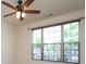 Bright bedroom featuring a ceiling fan and large windows with wooded blinds at 309 Kentmere Ln, Clover, SC 29710