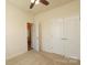 Cozy bedroom with a ceiling fan, neutral carpet and a double door closet at 309 Kentmere Ln, Clover, SC 29710