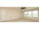 Bright bedroom with neutral carpet, a ceiling fan, and a window providing plenty of natural light at 309 Kentmere Ln, Clover, SC 29710