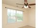 Bright bedroom with a ceiling fan and a window providing natural light at 309 Kentmere Ln, Clover, SC 29710